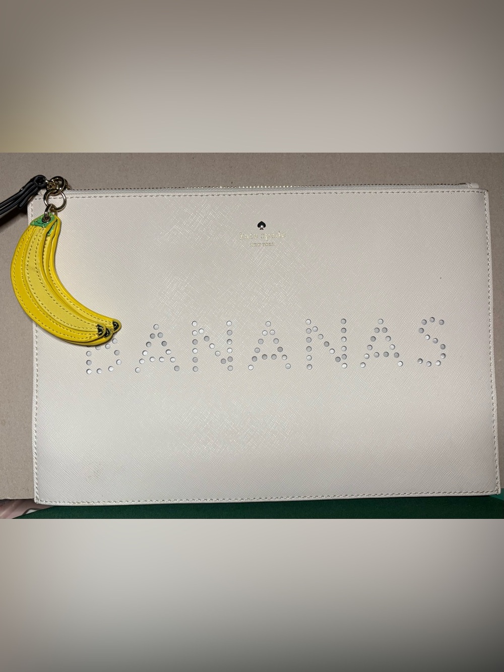 kate spade white clutch with yellow banana charm